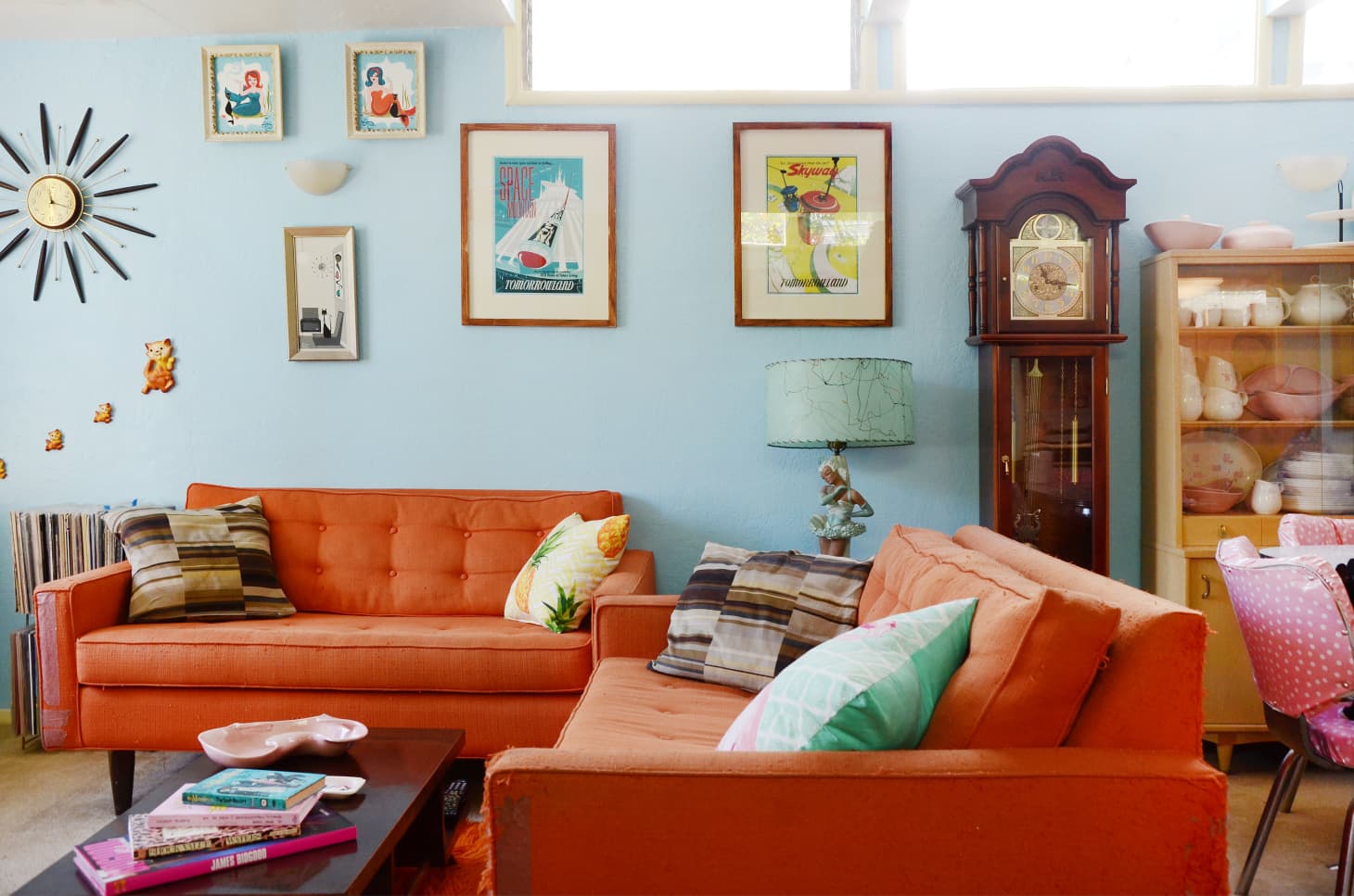 Orange sofa blue store wall